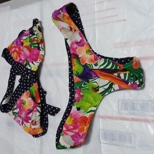 0.P. womens swim wear size s in a floral prints on the outside blue poka…